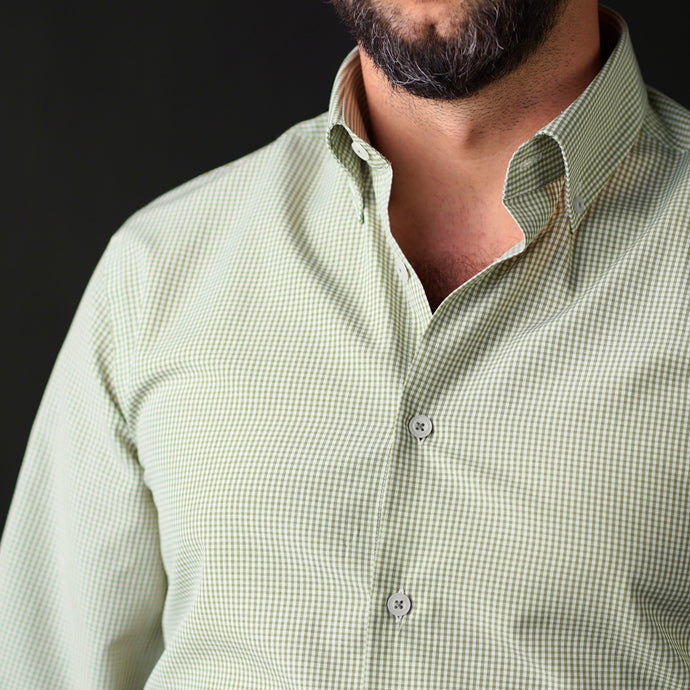 a man with a beard wearing a green shirt