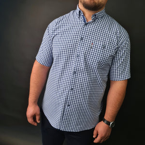 a man wearing a blue and white checkered shirt