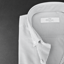 a black and white photo of a dress shirt