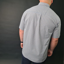 a man in a blue and white checkered shirt