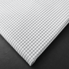 a close up of a white and black checkered fabric