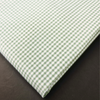 a close up of a green and white checkered fabric