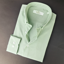 a close up of a green shirt on a table