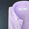 a close up of a purple and white checkered shirt