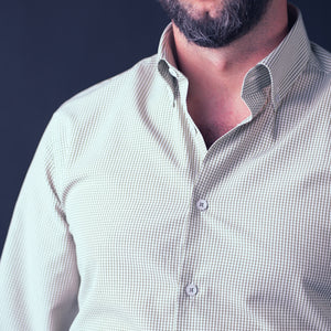 a man with a beard wearing a white shirt