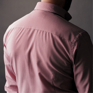 a man wearing a pink shirt and tie