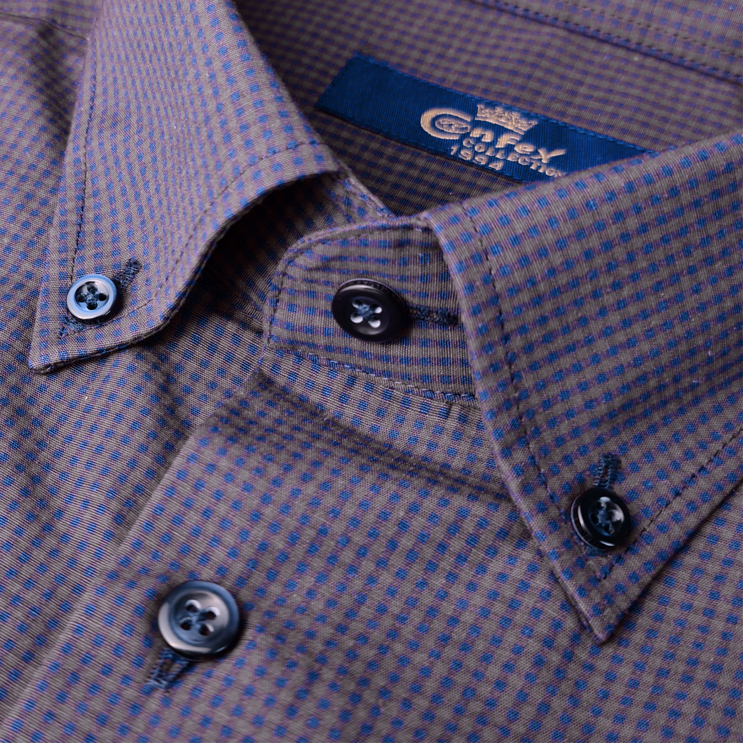 a close up of a blue and brown checkered shirt