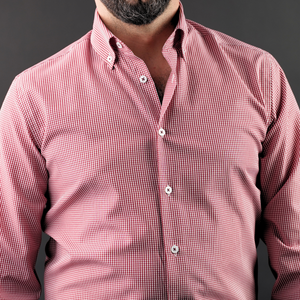 a man with a beard wearing a red shirt