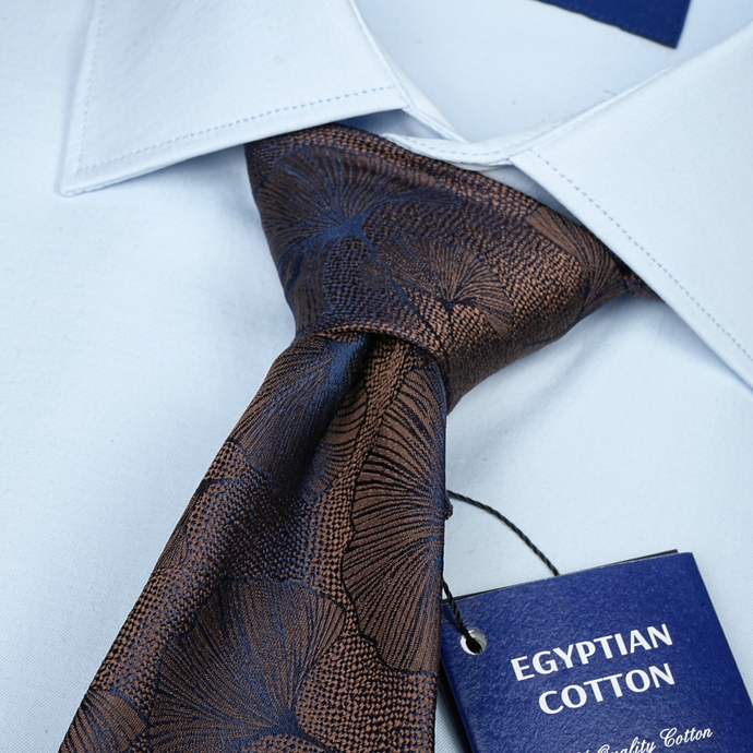 a close up of a tie with a tag on it