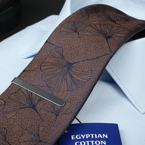 a close up of a tie on a shirt