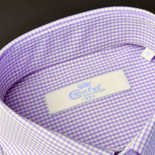 a close up of a purple and white checkered shirt