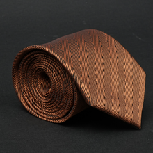 a close up of a tie on a black surface