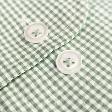 a close up of a green and white checkered shirt