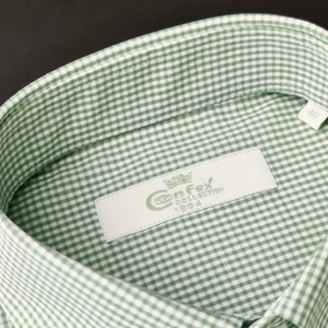 a close up of a green and white checkered shirt