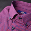 a close up of a pink and blue shirt