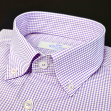 a close up of a purple and white checkered shirt