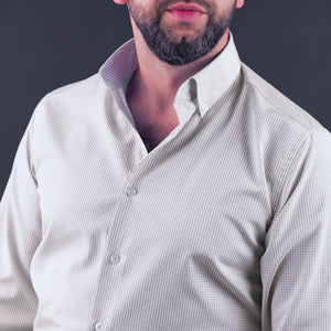 a man with a beard wearing a dress shirt