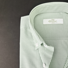 a close up of a green and white checkered shirt