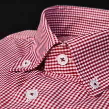 a close up of a red and white checkered shirt