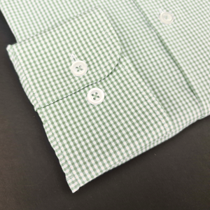 a close up of a green and white checkered shirt