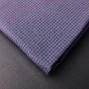 a close up of a purple and blue checkered tie