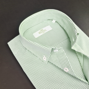 a close up of a green and white checkered shirt