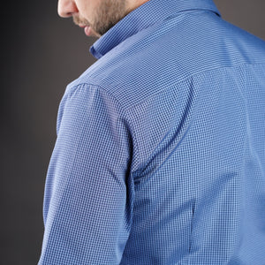 a man wearing a blue shirt and tie