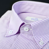 a close up of a purple and white checkered shirt